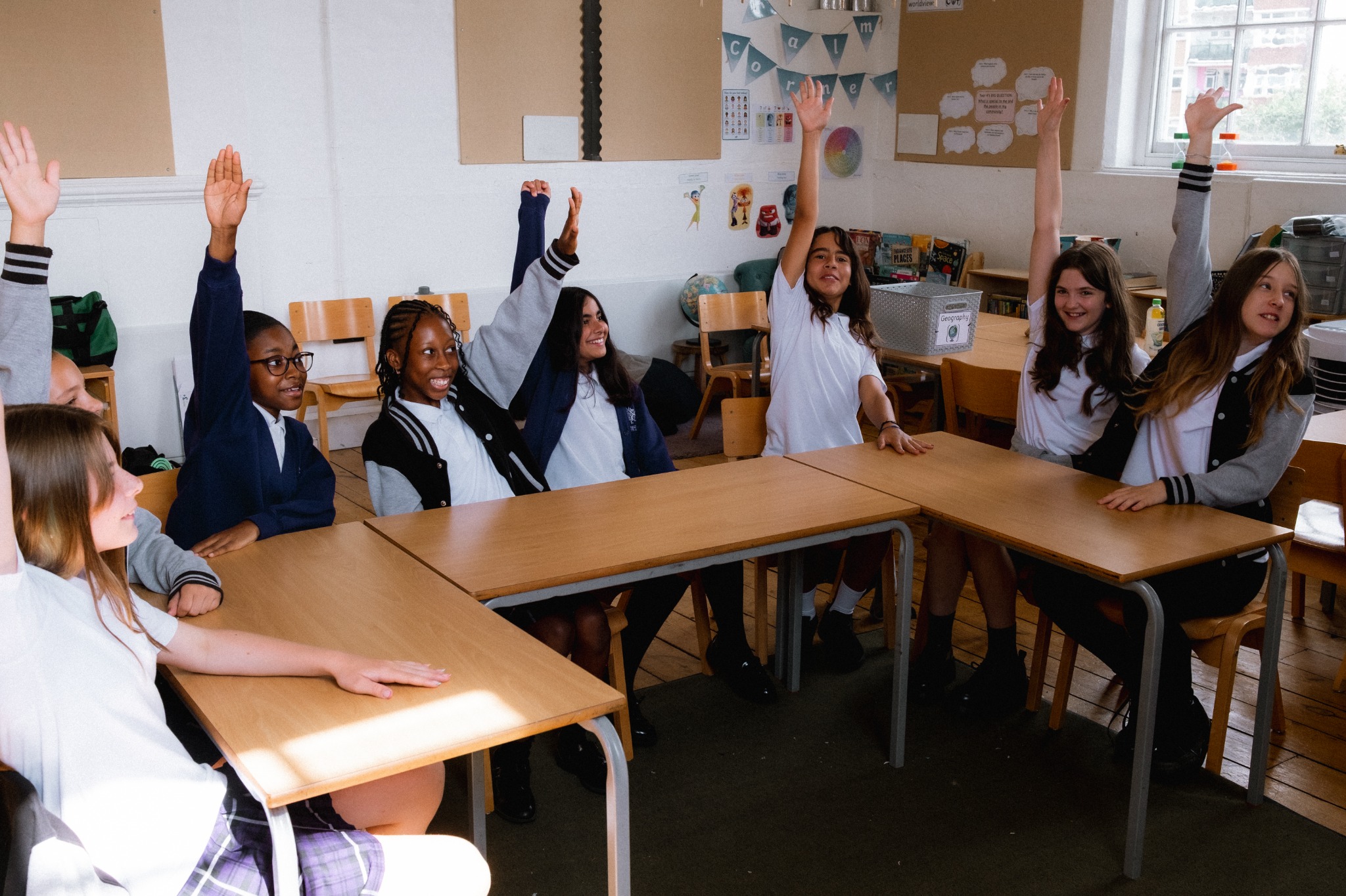 Year 6 pupils raising their hands during a Nutrigirls classroom session