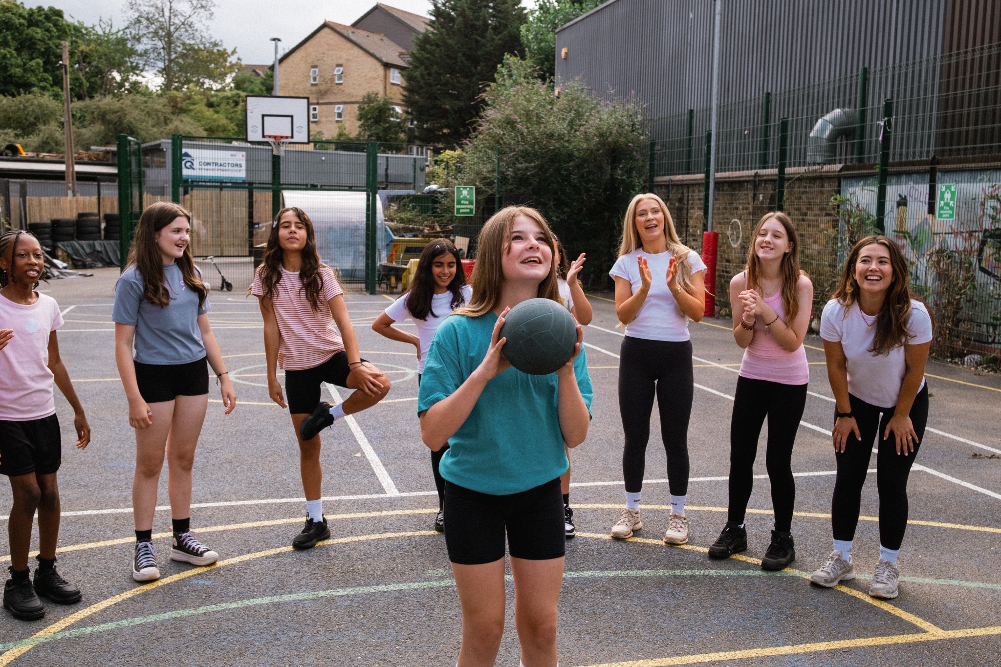 Year 6 pupils enjoying an outdoor movement activity with Nutrigirls facilitators